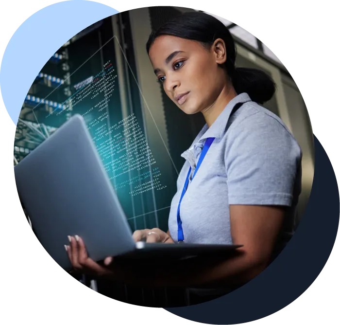 Woman checks a service laptop next to a server rack with representative data hovering in front of her